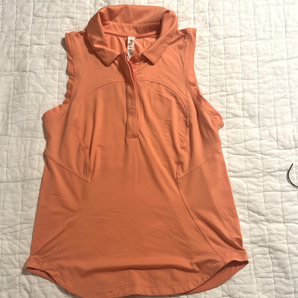 Lululemon peach colored Quick dry sleeveless polo shirt curved hem, size 6